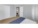 Bedroom featuring double closets and a view into the hallway at 3302 E Maritana Dr, St Pete Beach, FL 33706