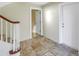 Entryway with tile floor, staircase, and doors at 3302 E Maritana Dr, St Pete Beach, FL 33706