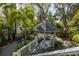 Elevated view of the gazebo surrounded by tropical landscaping in a serene setting at 3302 E Maritana Dr, St Pete Beach, FL 33706