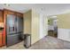 Spacious kitchen with stainless steel appliances and tile flooring near the dining room at 3302 E Maritana Dr, St Pete Beach, FL 33706
