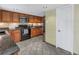 This kitchen features granite countertops, wood cabinetry, and stainless steel appliances at 3302 E Maritana Dr, St Pete Beach, FL 33706