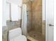 Clean bathroom with shower stall, tile walls, and a toilet at 3302 E Maritana Dr, St Pete Beach, FL 33706