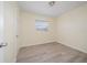 Charming bedroom with wood-look floors and a window at 3305 W Kathleen St, Tampa, FL 33607
