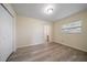 Spacious bedroom with wood-look floors and ensuite bathroom at 3305 W Kathleen St, Tampa, FL 33607
