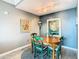 Cozy dining area with a round wooden table and four green chairs at 345 Bayshore Blvd # 610, Tampa, FL 33606