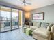 Tan sectional sofa in living room with balcony access at 345 Bayshore Blvd # 610, Tampa, FL 33606