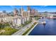 Stunning aerial view of waterfront condos with city skyline backdrop and water access at 345 Bayshore Blvd # 610, Tampa, FL 33606