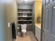 Bathroom featuring floating shelves, a towel bar, neutral-toned walls, and a single sink vanity with white cabinets at 345 Bayshore Blvd # 610, Tampa, FL 33606