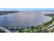 Aerial view of a tranquil waterfront scene with a bridge and boat at 345 Bayshore Blvd # 610, Tampa, FL 33606