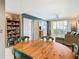 Bright dining area features a round wooden table with green chairs at 345 Bayshore Blvd # 610, Tampa, FL 33606