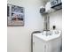 Well-lit laundry room with washer, dryer, and shelving at 345 Bayshore Blvd # 610, Tampa, FL 33606