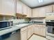 Modern kitchen featuring light wood cabinets, stainless steel appliances, and granite countertops at 345 Bayshore Blvd # 610, Tampa, FL 33606