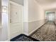 A well-lit hallway with carpeted floors and neutral-colored walls at 345 Bayshore Blvd # 610, Tampa, FL 33606