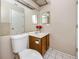 Bathroom with a vanity, toilet and mirror at 3454 Hillmoor Dr, Palm Harbor, FL 34685