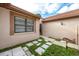 Backyard patio area with small garden and block pavers at 3454 Hillmoor Dr, Palm Harbor, FL 34685