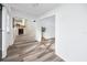 Bright hallway with wood-look floors, connecting to living room and other areas at 3454 Hillmoor Dr, Palm Harbor, FL 34685