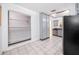 Well-lit kitchen featuring ample cabinet space, a stainless steel dishwasher, and tiled flooring at 3454 Hillmoor Dr, Palm Harbor, FL 34685