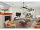 Bright living room with a fireplace, modern furniture, and neutral tones that create a cozy atmosphere at 3454 Hillmoor Dr, Palm Harbor, FL 34685