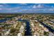 Aerial image of the home set among canals and residential properties in a waterfront community at 4086 13Th Ne Ln, St Petersburg, FL 33703