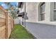 A small fenced backyard with artificial turf and a stucco exterior at 411 S Fremont Ave # B, Tampa, FL 33606