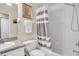 Cozy bathroom featuring a vanity, toilet, and shower with tiled flooring at 411 S Fremont Ave # B, Tampa, FL 33606