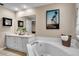 Luxurious bathroom with a soaking tub, double vanity, and stylish decor at 411 S Fremont Ave # B, Tampa, FL 33606