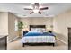 Cozy bedroom with a ceiling fan, carpet flooring, and a queen-sized bed at 411 S Fremont Ave # B, Tampa, FL 33606