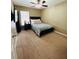 Cozy bedroom featuring carpet flooring, a ceiling fan, and a comfortable bed at 411 S Fremont Ave # B, Tampa, FL 33606
