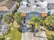 Aerial of the property with mature trees showcasing a red front door and a wide driveway at 411 S Fremont Ave # B, Tampa, FL 33606