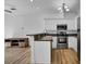 Modern kitchen featuring stainless steel appliances, white cabinets, and an island at 411 S Fremont Ave # B, Tampa, FL 33606