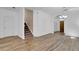 Living room featuring wood floors and a staircase at 411 S Fremont Ave # B, Tampa, FL 33606