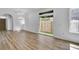 Open-concept living and dining area with sliding glass doors to the backyard at 411 S Fremont Ave # B, Tampa, FL 33606