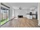 Open floor plan featuring living area, kitchen, and sliding glass doors at 411 S Fremont Ave # B, Tampa, FL 33606