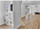 Open floor plan features a half bath, living space, and sliding glass doors to backyard at 411 S Fremont Ave # B, Tampa, FL 33606
