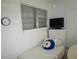 Small bedroom with a twin bed, dresser, and TV at 6000 20Th N St # 129, St Petersburg, FL 33714