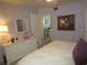 Bedroom with dresser, mirror, and view to living area at 6000 20Th N St # 129, St Petersburg, FL 33714