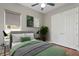 Cozy bedroom with a double door closet and green accents at 8306 Windsor Bluff Dr, Tampa, FL 33647