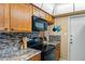 Close-up of kitchen's stovetop and microwave at 8430 Brentwood Rd # 8430, Seminole, FL 33777