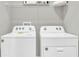 Laundry room with side-by-side washer and dryer at 1566 Hammer Pl, Largo, FL 33774