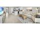 Open living room with a view of the kitchen and access to the backyard at 1566 Hammer Pl, Largo, FL 33774