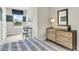 Second bedroom with dresser and workspace, great for guests at 1574 Hammer Pl, Largo, FL 33774