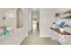 Bright and spacious entry hallway with a console table at 1590 Hammer Pl, Largo, FL 33774