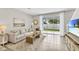 Spacious living room with sliding glass doors leading to the backyard at 1590 Hammer Pl, Largo, FL 33774