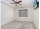 Spacious bedroom with ceiling fan and window shutters at 2468 Kensington Greens Dr, Sun City Center, FL 33573