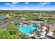 Resort-style community pool with ample deck space and shaded areas at 2468 Kensington Greens Dr, Sun City Center, FL 33573