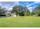 Large backyard with shed and spacious grassy area at 33137 Cercelia Rd, Dade City, FL 33523