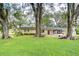 Ranch style home with mature trees and a spacious lawn at 33137 Cercelia Rd, Dade City, FL 33523