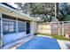 Home with a screened patio and a wooden fence at 33137 Cercelia Rd, Dade City, FL 33523