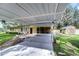 Carport with attached screened porch and view of backyard at 33137 Cercelia Rd, Dade City, FL 33523