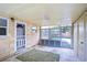 Covered porch with access to backyard and storage at 33137 Cercelia Rd, Dade City, FL 33523